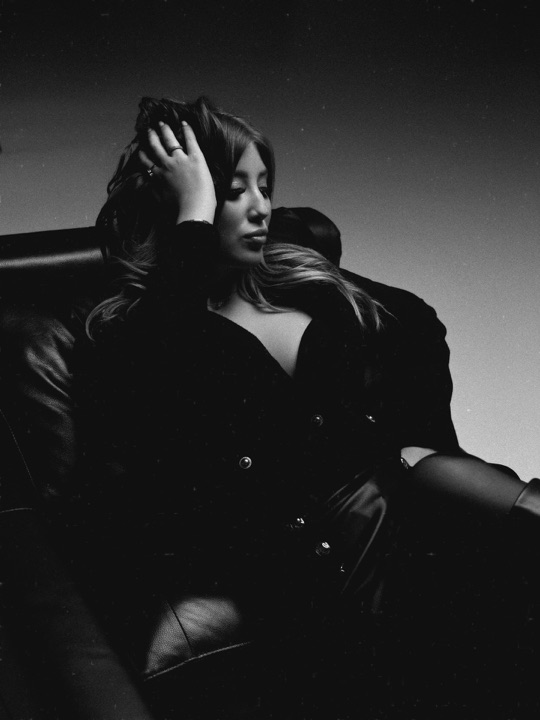 Black and white portrait in a leather armchair
