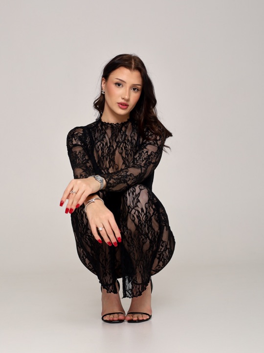 Studio portrait in a black lace dress