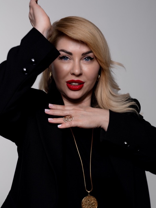 Portrait with red lipstick and hands framing the face